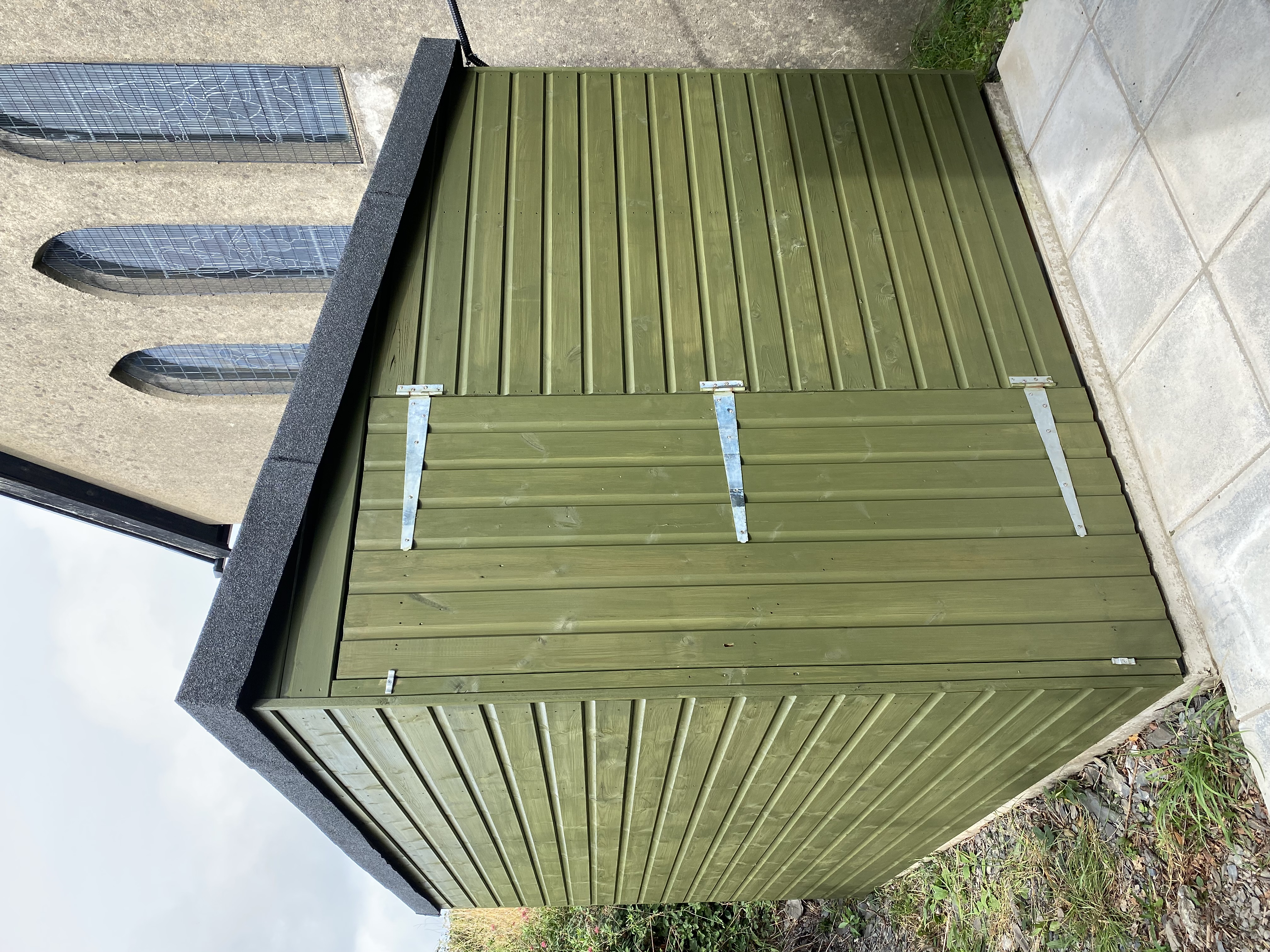 Photograph showing new shed painted green as requested